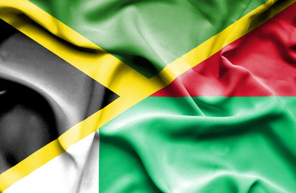 Vlající vlajka Madagaskaru a Jamajka — Stock fotografie