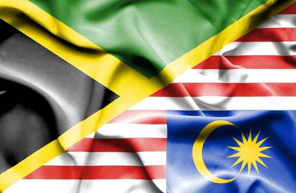 Waving flag of Malaysia and Jamaica — Stock Photo, Image