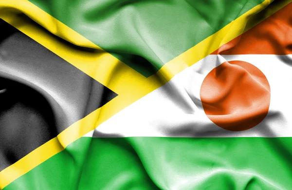 Waving flag of Niger and Jamaica — Stock Photo, Image