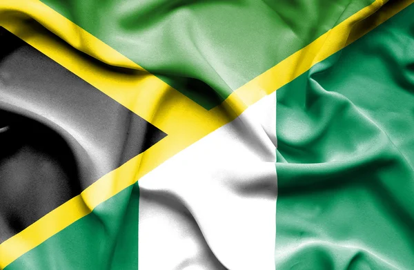 Ondeando la bandera de Nigeria y Jamaica — Foto de Stock