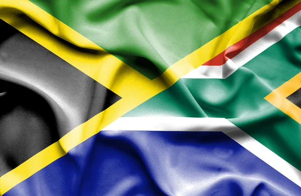 Waving flag of South Africa and Jamaica — Stock Photo, Image