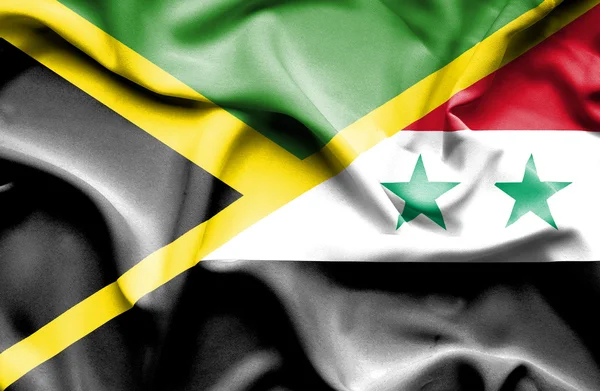 Integetett a Szíria és Jamaica zászlaja — Stock Fotó