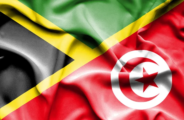 Wapperende vlag van Tunesië en Jamaica — Stockfoto