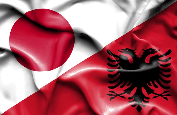 Flagge von Albanien und Japan schwenkend — Stockfoto