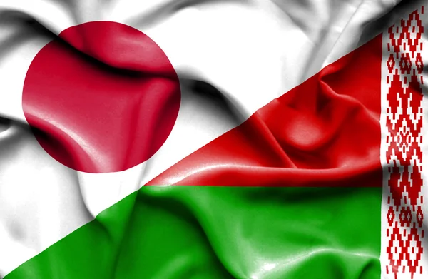 Beyaz Rusya ve Japonya bayrağı sallayarak — Stok fotoğraf