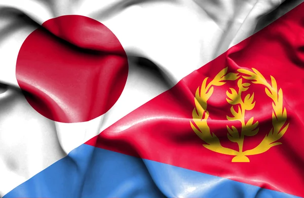 Fahne von Eritrea und Japan schwenkend — Stockfoto