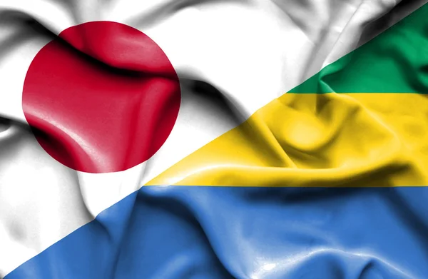 Waving flag of Gabon and Japan — Stock Photo, Image
