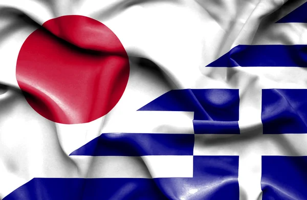 그리스와 일본의 국기를 흔들며 — 스톡 사진