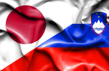 Slovenya ve Japonya bayrağı sallayarak