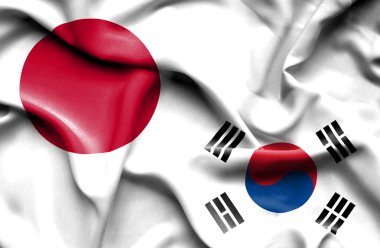 Güney Kore ve Japonya bayrağı sallayarak