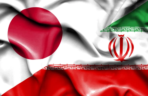 Flagge von Iran und Japan schwenkend — Stockfoto