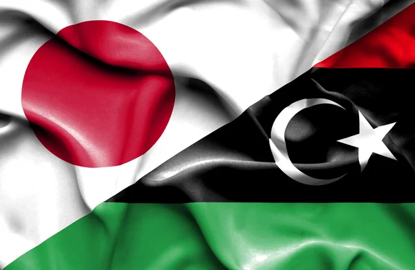 Vlající vlajka Libye a Japonska — Stock fotografie