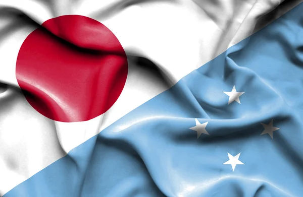 Waving flag of Micronesia and Japan — Stock Photo, Image