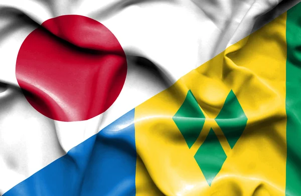 Waving flag of Saint Vincent and Grenadines and Japan — Stock Photo, Image