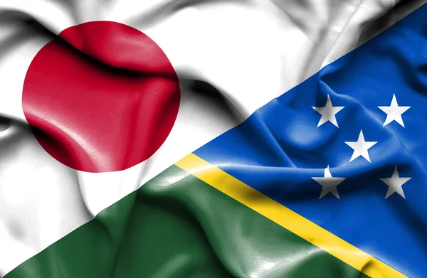 Wapperende vlag van Salomonseilanden en Japan — Stockfoto