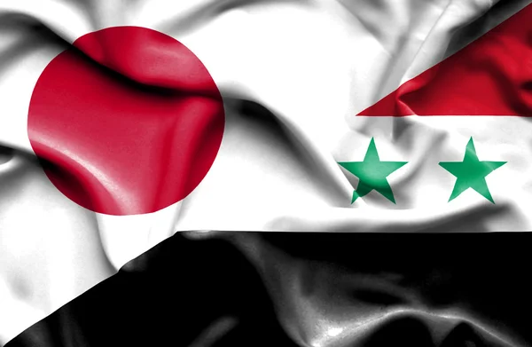 Wapperende vlag van Syrië en Japan — Stockfoto