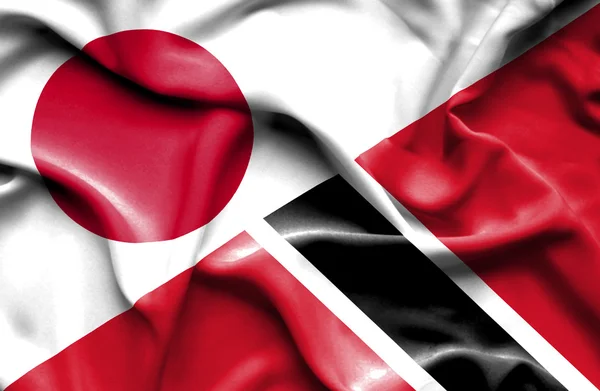 Waving flag of Trinidad and Tobago and Japan — Stock Photo, Image