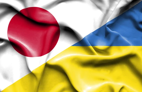 Waving flag of Ukraine and Japan — Stock Photo, Image