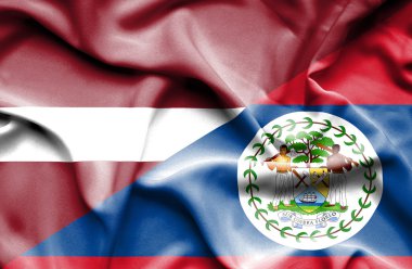 Belize ve Letonya bayrağı sallayarak