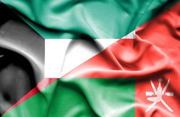 Flagge von Oman und Kuwait schwenken — Stockfoto