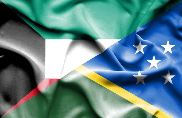 Waving flag of Solomon Islands and Kuwait — Stock Photo, Image