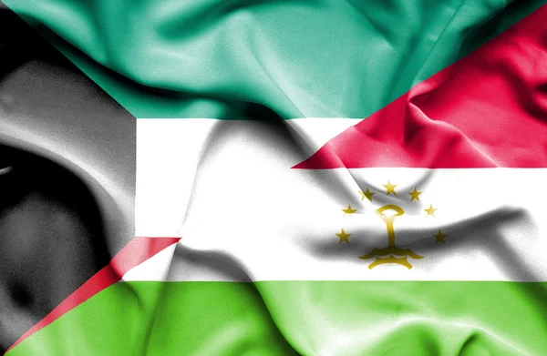 Waving flag of Tajikistan and Kuwait — Stock Photo, Image