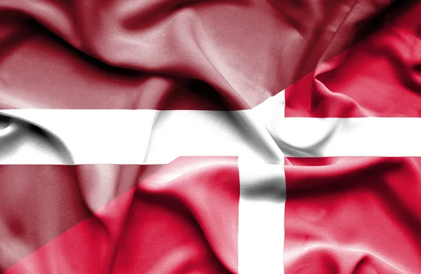 Waving flag of Denmark and Latvia — Stock Photo, Image