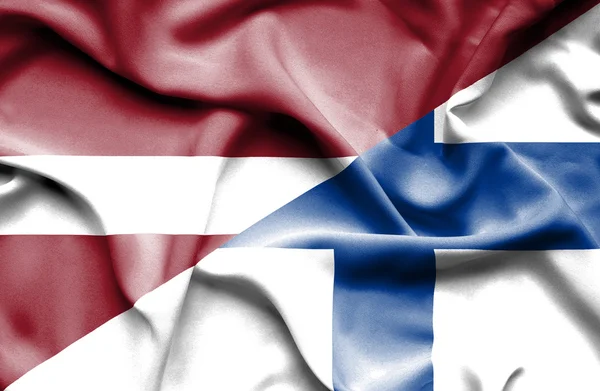 Bandiera sventolante di Finlandia e Lettonia — Foto Stock