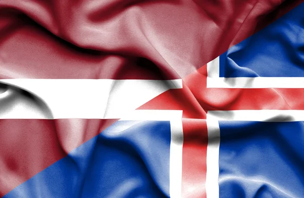 Waving flag of Iceland and Latvia — Stock Photo, Image