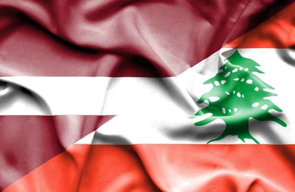 Wapperende vlag van Libanon en Letland — Stockfoto