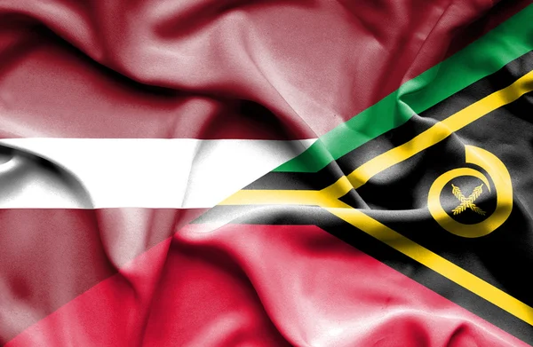 Waving flag of Vanuatu and Latvia — Stock Photo, Image