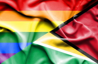 Guyana ve Lgbt bayrağı sallayarak