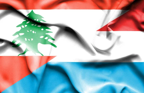 Waving flag of Luxembourg and Lebanon — Stock Photo, Image