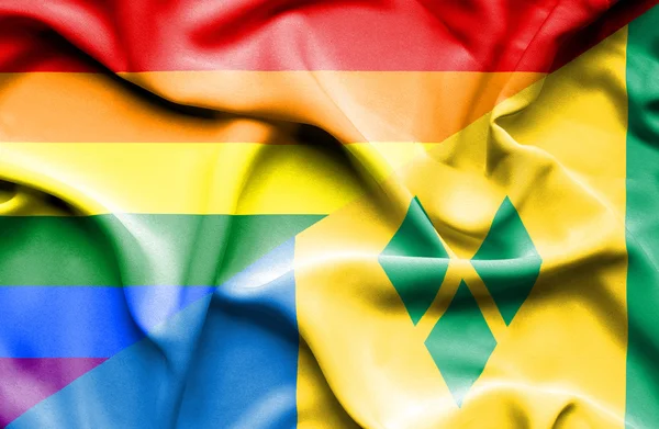 Viftande flagga Saint Vincent och Grenadinerna och HBT — Stockfoto