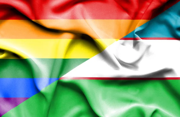 Ondeando la bandera de Uzbekistán y LGBT — Foto de Stock