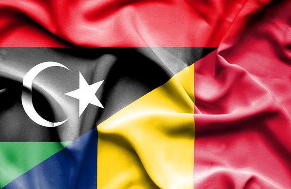 Waving flag of Chad and Libya — Stock Photo, Image