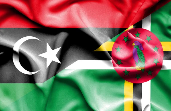 Wapperende vlag van Dominica en Libië — Stockfoto