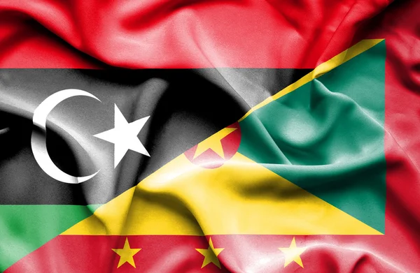 Ondeando la bandera de Guernsey y Libia — Foto de Stock