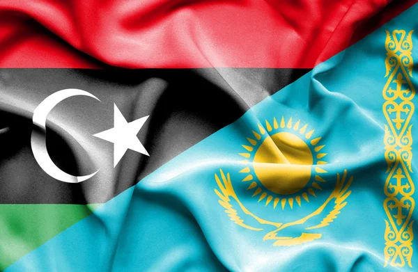 Waving flag of Kazakhstan and Libya — Stock Photo, Image