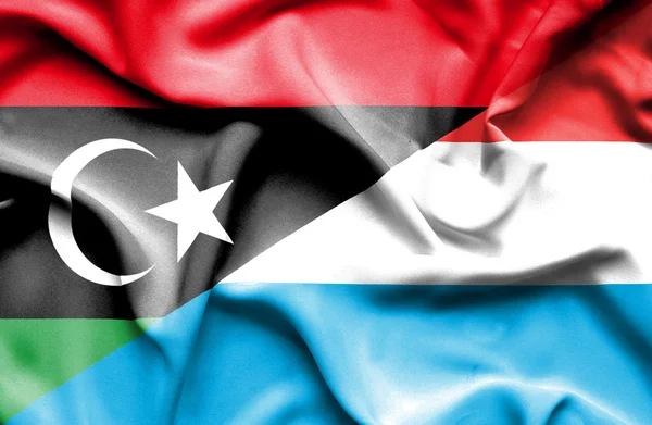 Bandera ondeante de Luxemburgo y Libia —  Fotos de Stock