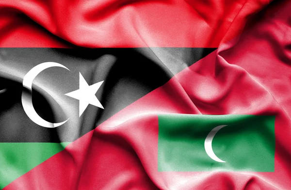 Waving flag of Maldives and Libya — Stock Photo, Image