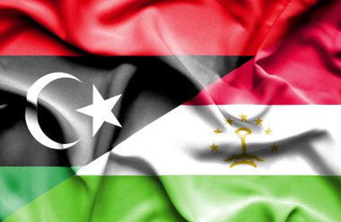 Tacikistan ve Libya bayrağı sallayarak