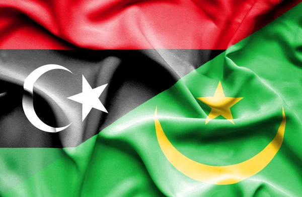 Waving flag of Mauritania and Libya — Stock Photo, Image