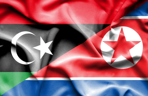 Ondeando la bandera de Corea del Norte y Libia —  Fotos de Stock