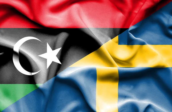 Bandera ondeante de Suecia y Libia —  Fotos de Stock