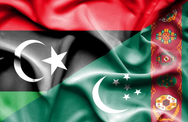 Waving flag of Turkmenistan and Libya — Stock Photo, Image