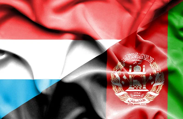 Afganistan ve Lüksemburg bayrağı sallayarak — Stok fotoğraf
