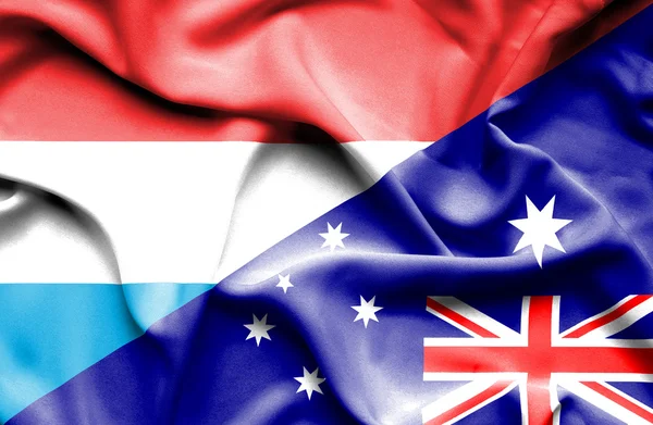 Wapperende vlag van Australië en Luxemburg — Stockfoto