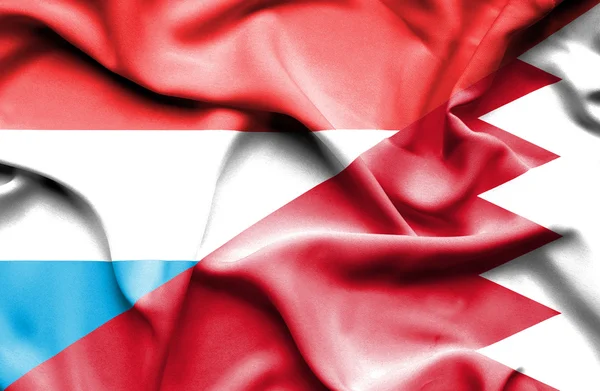 バーレーンおよびルクセンブルクの旗を振っています。 — ストック写真