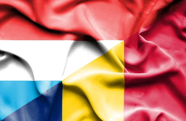 Waving flag of Chad and Luxembourg — Stock Photo, Image